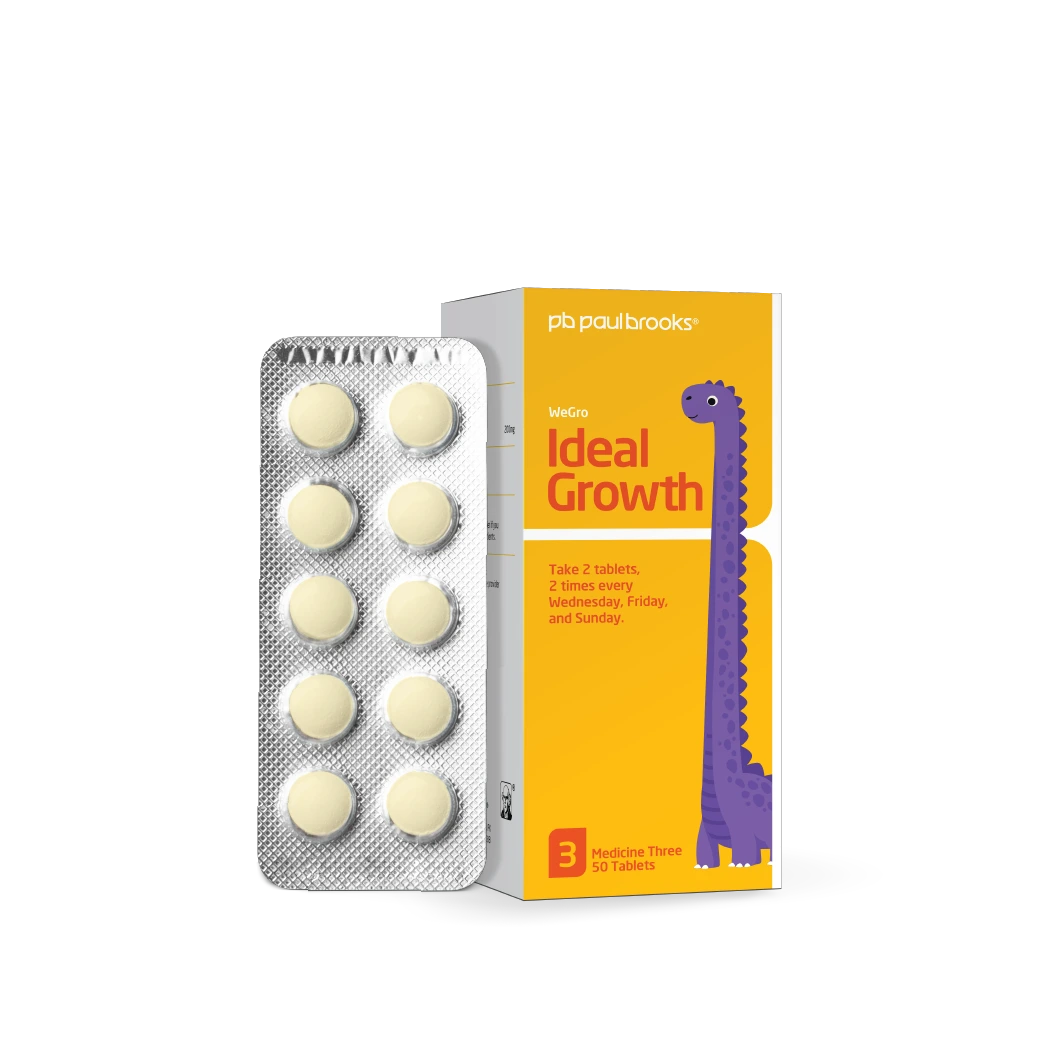 Packaging of 'Ideal Growth' tablets with a dinosaur illustration on a white background