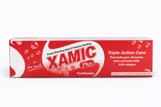 Red and white box of Xamic Plus toothpaste on a white background